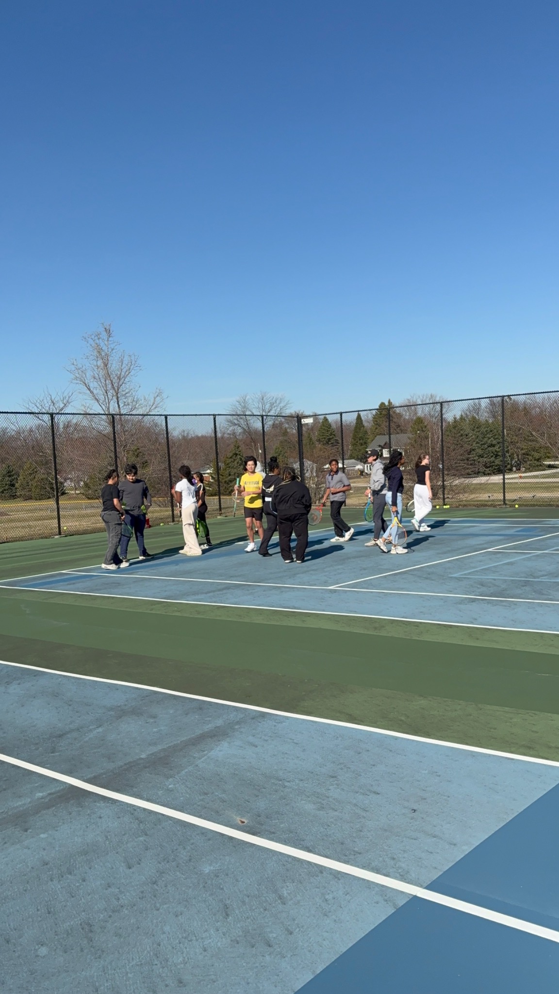 Students gathering with tennis rackets at Brown Deer Middle and High School